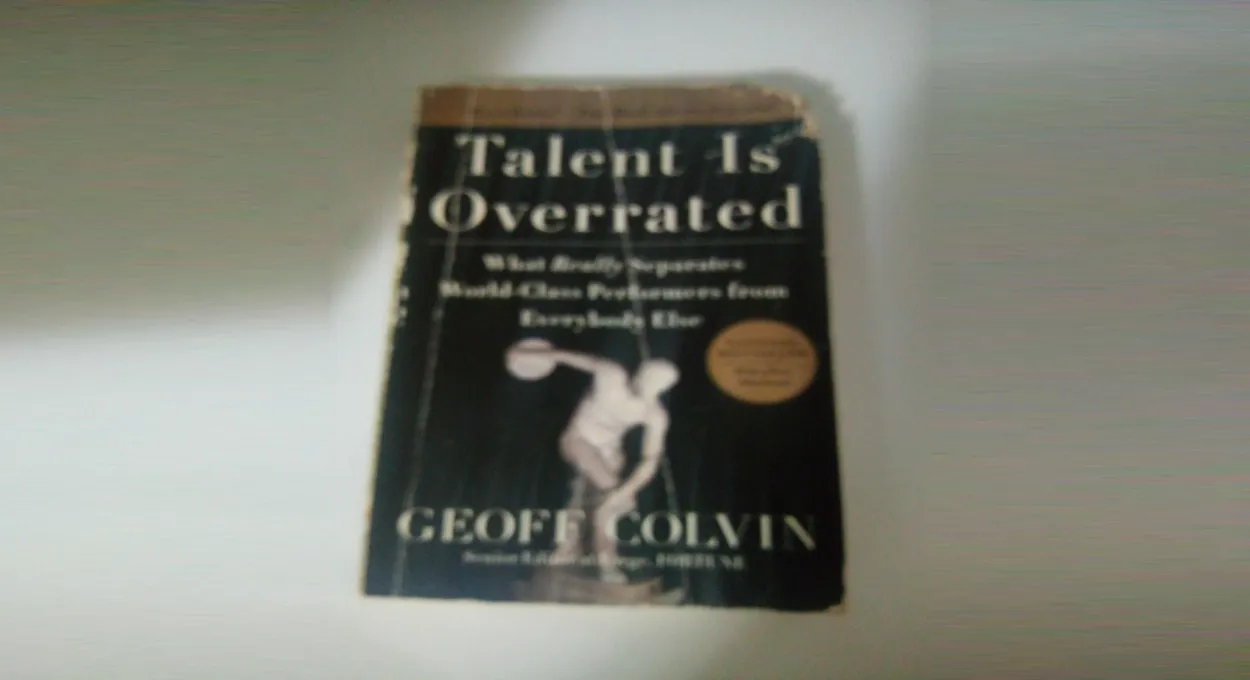 A blurry image of a well-read book called Talent Is Overrated: What Really Separates World-Class Performers from Everybody Else